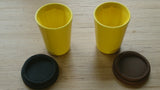 A pair of yellow Therma cups