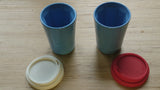 A pair of blue Therma cups