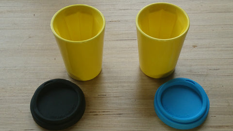 A pair of yellow Therma cups