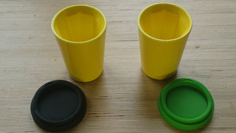 A pair of yellow Therma cups