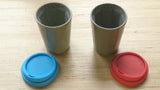 A pair of grey Therma cups