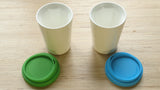 A pair of white Therma cups